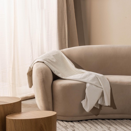 Sofa 2-osobowa Longi jasnobeżowa, welur, obłe kształty