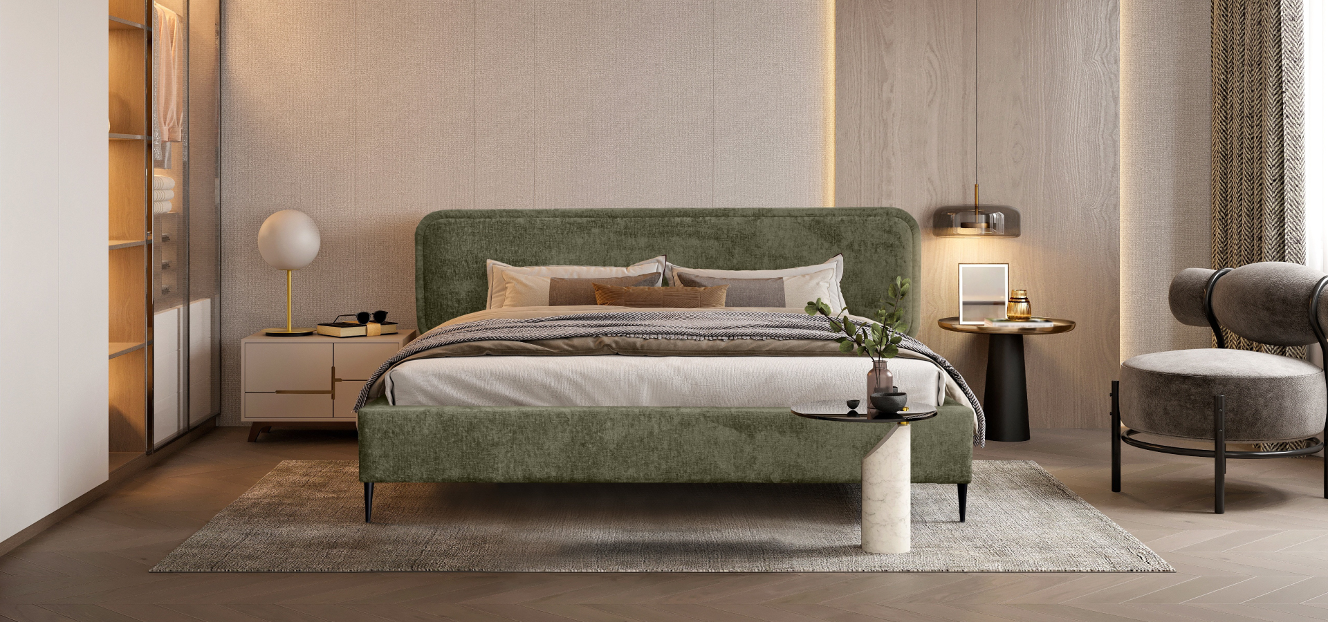 Zielone łóżko na czarnych nóżkach w eleganckiej sypialni w odcieniach szarości i beżów. W tle stoliki kawowe, szafka nocna oraz designerski fotel.